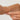 Gold pearl drops bracelet shown worn around a wrist
