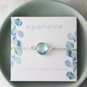 Aquamarine bracelet shown wrapped around an insert card