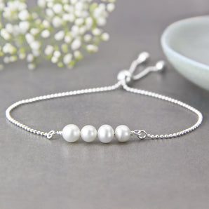 40th Birthday Pearl Sliding Bracelet displayed on a grey surface