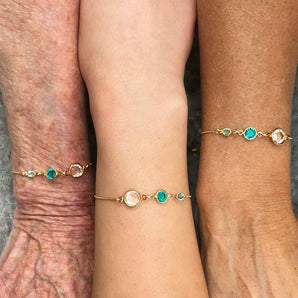 Three Generations Birthstone Sliding Bracelet shown worn on three generations of model's wrists