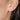 Model wearing Sterling Silver Twisted Hoop Huggie Stud Earrings