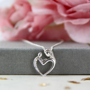 Close up view of Sterling Silver Mother And Child Pendant Heart Necklace