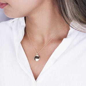 Round Small Locket Necklace shown worn around a model's neck