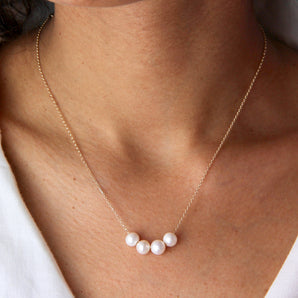 40th Birthday Floating Pearls Necklace shown worn around a model's neck