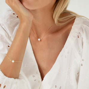 Gold Filled Floating Pearl Necklace with matching bracelet worn by a model