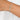 Silver bracelet with slider clasp  on a wrist with a plain background