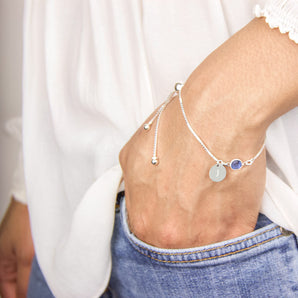 Birthstone sliding bracelet with an engraved charm