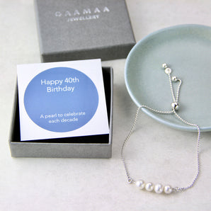 40th Birthday Pearl Sliding Bracelet displayed against a dish and gift box