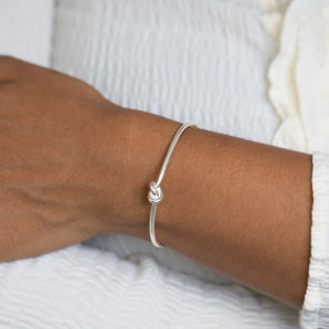 Friendship knot bangle on model's wrist