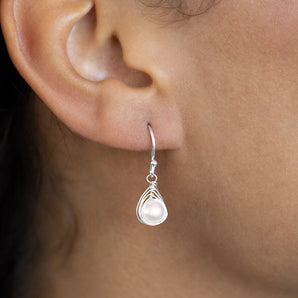 Silver Pearl Drop Earrings in model's ear