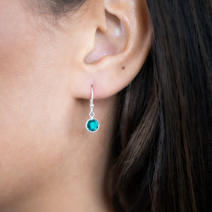 Model wearing Silver Birthstone Earrings - December birthstone