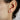 climber silver heart earrings on model's ear