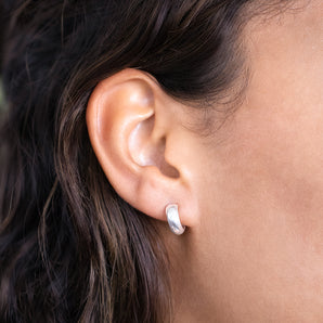 Model wearing Silver Huggie Earrings