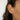 Close-up of an ear wearing a diamond ear cuff earring with a blurred background