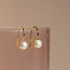 Close up view of Pearl Drop Earrings In Sterling Silver