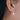 Pearl Drop Earrings In Sterling Silver shown worn in a model's ear