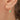 model wearing molten birthstone hoop earrings with May birthstone