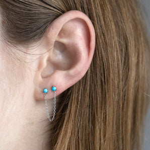 Sterling Silver Chain Double Turquoise Stud Earrings shown worn in a model's ear
