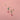 gold birthstone earrings on pink background