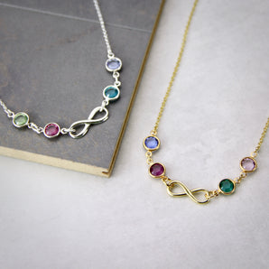 Silver and gold necklaces with infinity charm and birthstones