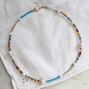 Close up view of Rainbow Multicoloured Seed Bead And Pearl Necklace