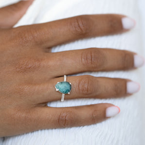 Model wearing silver raw emerald ring