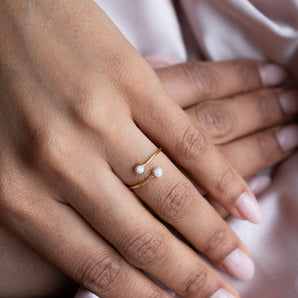 Gold Filled Opal Open Adjustable Ring shown worn on a model's finger