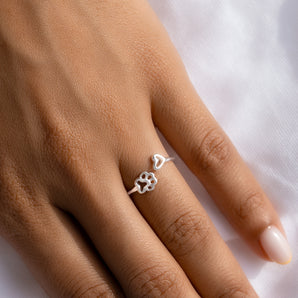 Sterling Silver Paw and Heart Open Ring shown worn on a model's finger