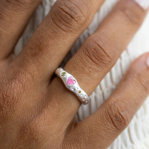 Model wearing Sterling Silver Molten Ring with Pink Heart Gemstone